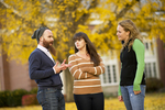 Three Students in the Fall Leaves - 4 by Asbury Theological Seminary Communications