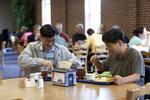 Two International Students Eating in the Dining Hall - 2 by Asbury Theological Seminary Communications