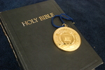 The Presidential Medal on Top of a Closed Bible - 3 by Asbury Theological Seminary Communications