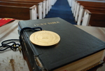 The Presidential Medal on Top of a Closed Bible in Estes Chapel - 2 by Asbury Theological Seminary Communications