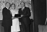 Abbott, J. D. gives 1977 Holiness Exponent of the year award to Bishop Henry Ginder