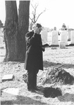 Man participating in reading at burial service at Bishops Lot, Baltimore, MD, 1973