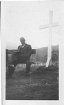 ESJ in San Anselmo, CA, seated outdoors in front of a cross