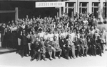 ESJ in group photo with the Finnish Ashram al holding up sign "Jesus is Lord", 1963